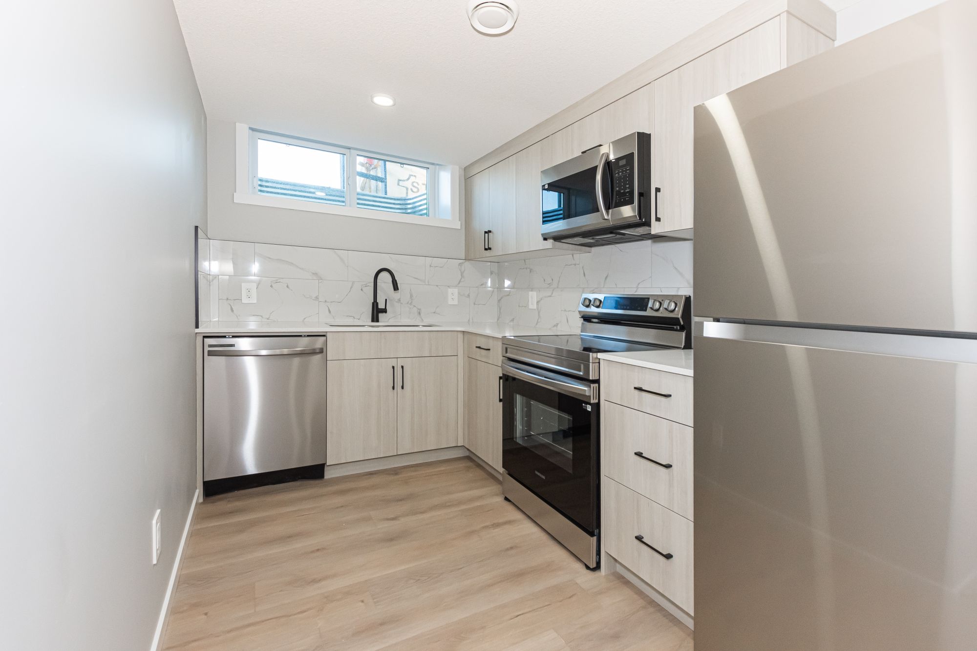 Air-Conditioned Edgemont Basement Suite with Private Entrance & In-Suite Laundry